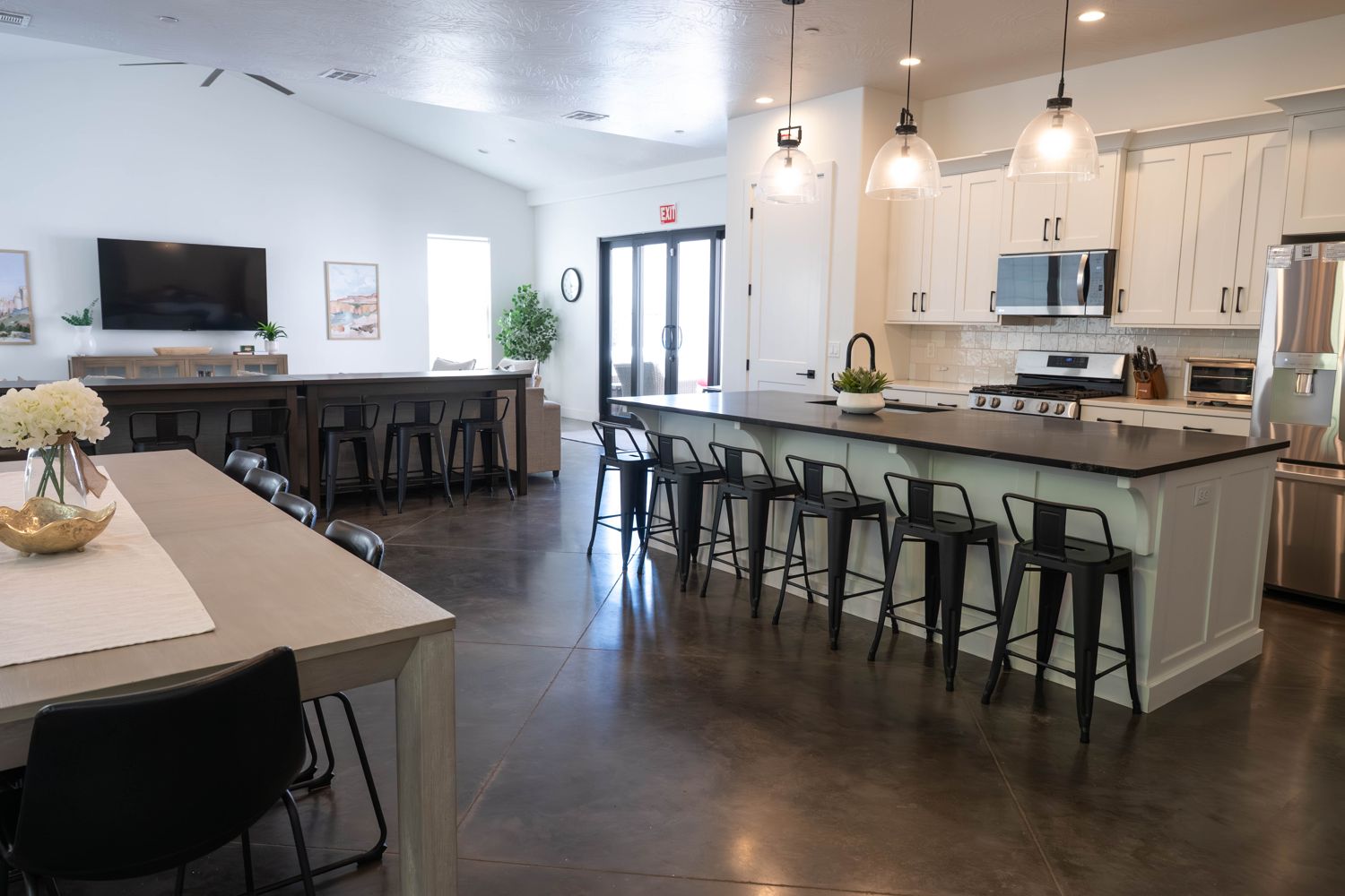 Open kitchen with a large island and barstools